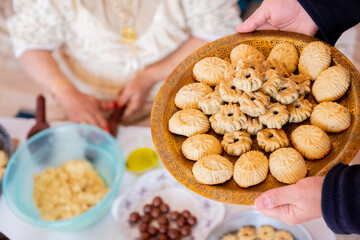 Arabic woman hands making eid sweets ,cookiesand mamoul