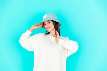 portrait of a beautiful girl in a denim cap