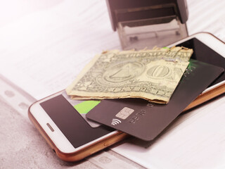 Bank card, dollars and smartphone, credit