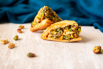 Arabic sweets named baklava filled with pistachio
