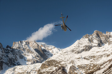 Naklejka na ściany i meble Mont Blanc mountain range (Italian side) and helicopter taking off.