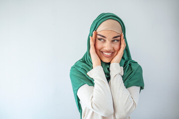 Arabian woman with happy smile. Islamic. Portrait of beautiful young model in fashionable hijab...