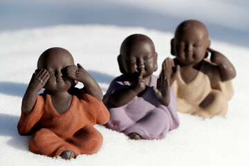 Hear no evil see no evil speak no evil figurines set of 3 sitting monks in the snow. France. ...