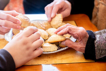 a bunch of people eating and enjoying Eid
