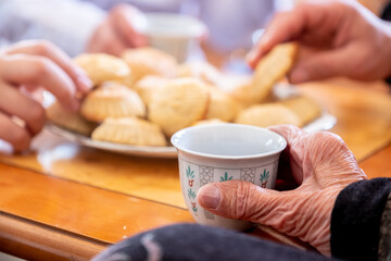 the person holding a cup of coffee