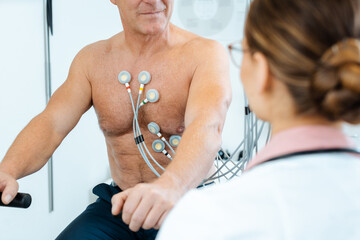 Doctor discussing with patient results of stress ECG