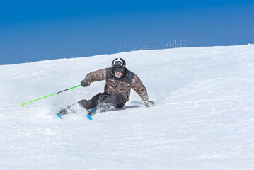 Fototapeta na wymiar Young man skiing on a sunny day in Andorra
