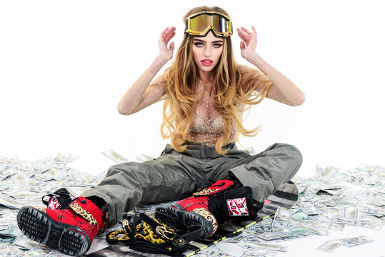 Snowboard girl in Ski mask. Female snowboarder. Wintertime. Extreme Winter sport.