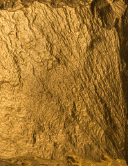 Gold texture. Rough structure mineral. Rock texture. Gold Ore. Gold rocks. Stone background.