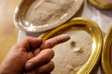 Ash wednesday celebration in a catholic roman church. Saint Gervais. France.  22.03.2018