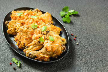 Spicy chicken stew in cast iron skillet. Space for text.