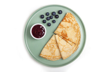 Pancake on the green plate on white background