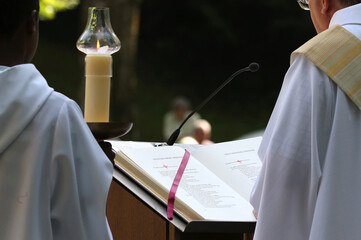  Sanctuary of La Benite Fontaine. Catholic mass. Gospel Book.  Liturgy of the Word. France....