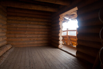 Empty room inside a new wooden log house.