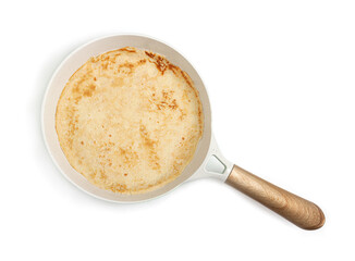 Pancake on a cast-iron frying pan.