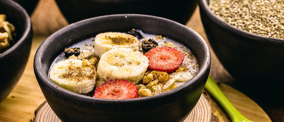 vegan quinoa porridge, Strawberry, bananas, ground nuts and sprinkled cinnamon. Lactose-free dessert without milk