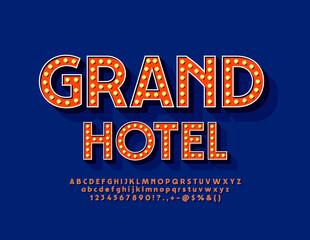 Vector bright glowing poster Grand Hotel. Illuminated light bulbs Alphabet Letters, Numbers and Symbols. Chic vintage Font with Lamp.