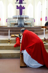 Gia Dinh Church.  Holy Week. Catholic mass.  Good Friday.  Priest kissing the cross.  Ho Chi Minh...
