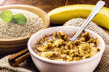 bowl of quinoa porridge, with banana, nuts and cinnamon. Lactose-free vegan dessert, sweet without milk