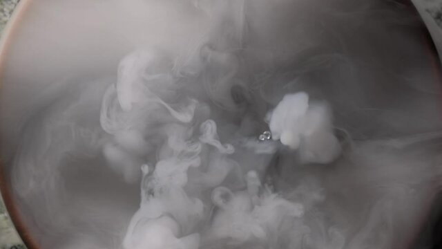 Texture of colored smoke close up. View from above.