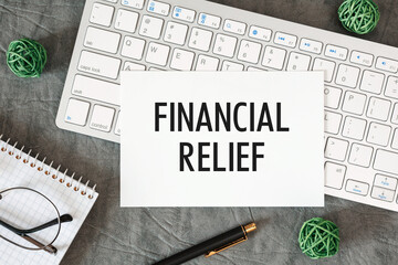 FINANCIAL RELIEF is written in a document on the office desk