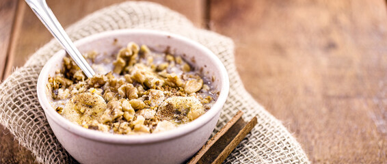 Recycled bowl with vegan dessert, made of quinoa, fruits and cinnamon, with copy space