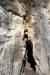 a cave in a rock wall