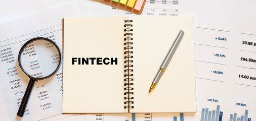 FINTECH - on an open notebook with blank pages