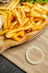 burger on a plate with french fries and sauce