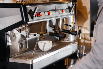 Making delicious coffee in a modern coffee shop close-up.