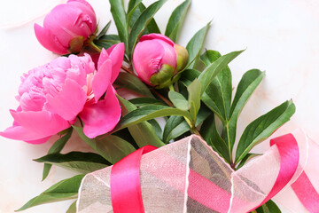 spring flowers. flower arrangement of pink peonies and place for text 