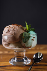 Chocolate, mint and vanilla ice-cream set in sundae bowl, refreshing creamy dessert for summertime. Food background