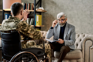 Psychotherapist listening to military man in wheelchair