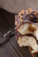 Fresh donut close up. Bitter chocolate donut with filling. 