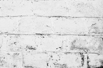Texture of a brick wall with cracks and scratches which can be used as a background