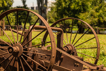 Old agricultural machines rusting in a farm