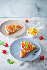 Onion tomato cream cheese whole grain galette in a plate