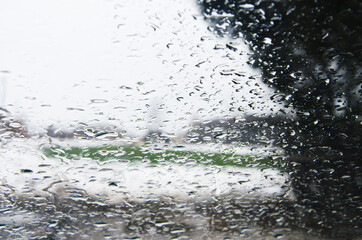 Naklejka na ściany i meble water drops on the glass surface. raining weather