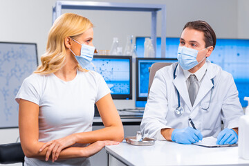 Professional doctor makes a coronavirus vaccine using a syringe and hypodermic needle. Professional...