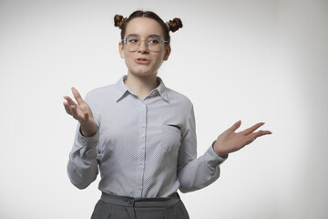 Stylish young girl office worker spread hands weigh pros and cons make choice on studio backdrop with blank space for ad