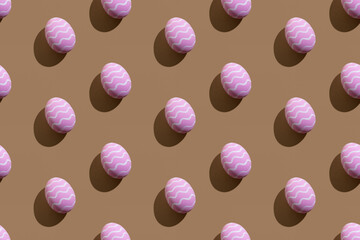 Easter seamless pattern. Festive decor. Holiday art. Abstract background. Pink painted paschal eggs with white zigzag lines isolated on beige.