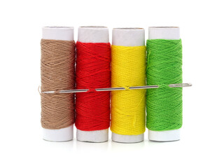 Four spools of thread and needle.