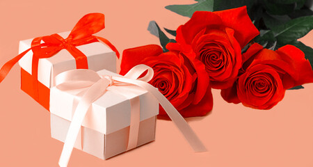 red roses with gift boxes on orange background for loved ones