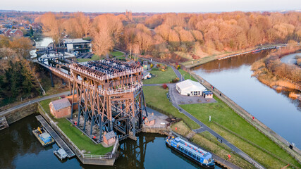 The Anderton Boat Lift is a two caisson lift lock near the village of Anderton, Cheshire, in North West England. It provides a 50-foot vertical link between the River Weaver and Trent and Mersey Canal