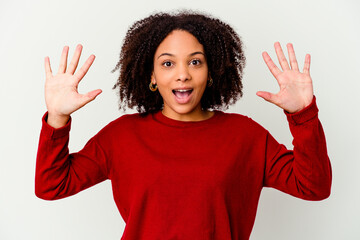 Young african american mixed race woman isolated receiving a pleasant surprise, excited and raising...