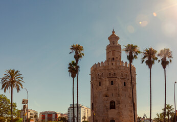 Fototapeta na wymiar The Tower of Gold (Torre del Oro) is a dodecagonal military watchtower in Seville that was built by Almohads to control the entrance of Guadalquivir river. A mediaval strategic post and prison.