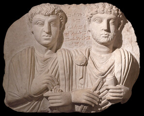 Ancient bas relief of Grave Stele from Palmyra, Syria. Roman period, 200-273 AD. The inscription says that the two figures are Iedi Bel and his son Zabde'ateh.