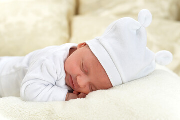Fototapeta na wymiar cute little baby boy on bed sleeping
