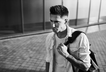 Young european man standing on a city street
