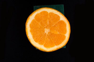 Ripe orange isolated on black background. slice of orange isolated on black background.